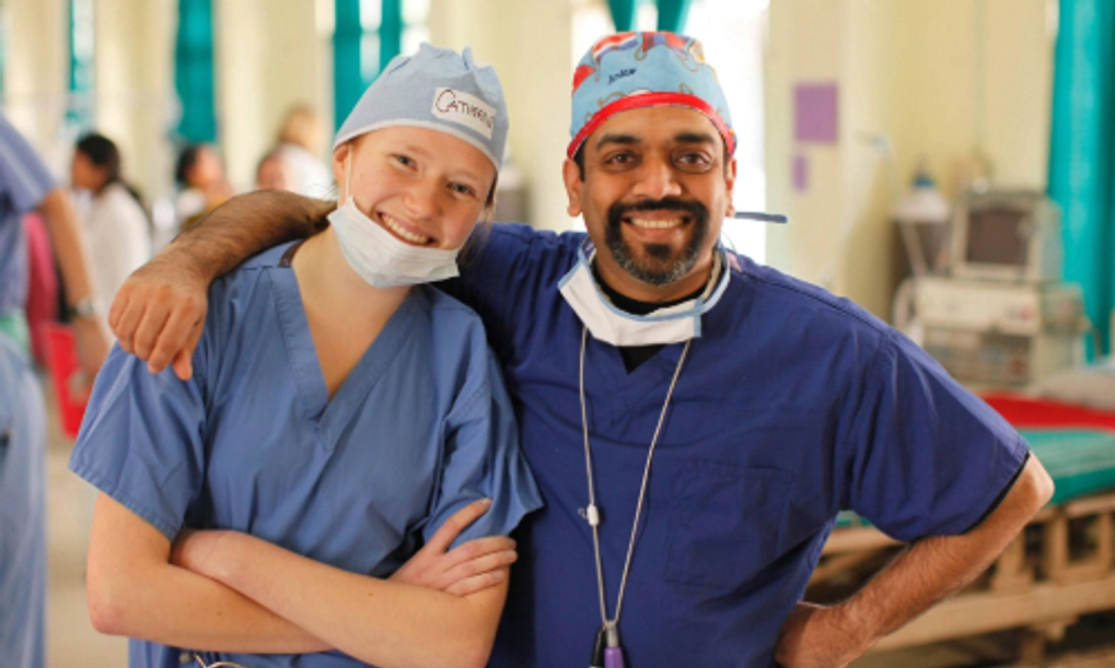 Two medical professionals hugging