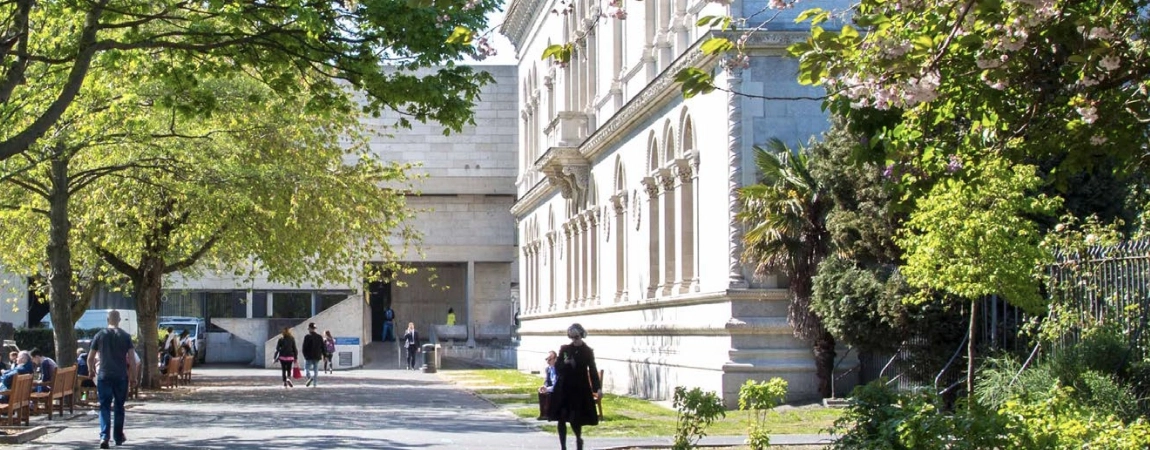 A student walking by the Museum Building