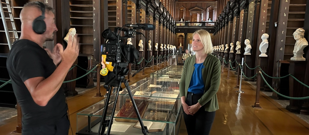 John Cassidy IT filming with Laura Shanahan in the Old Library