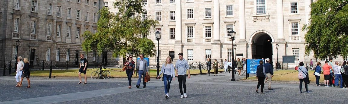 People walking along Trinity's Front Square