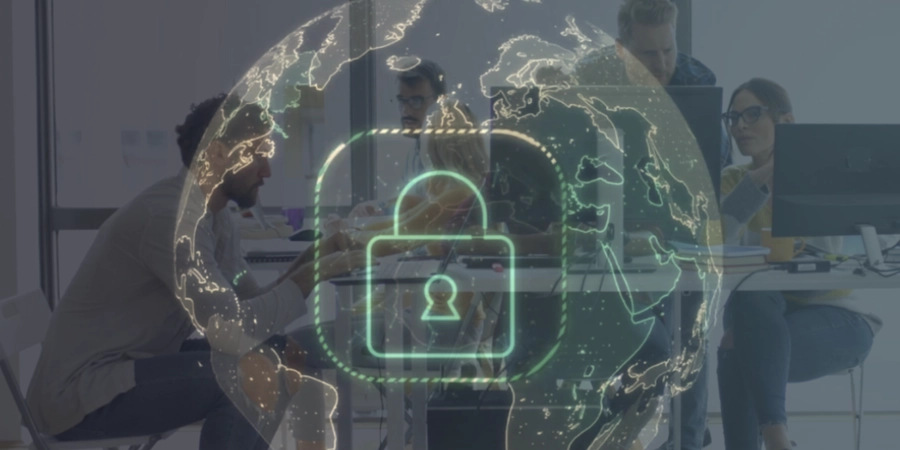 A group of people working on computers while staying cybersecure