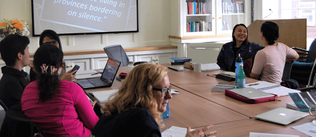 Students seated around a table during a Literary Translation class.