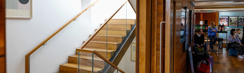 wooden staircase in the long room hub