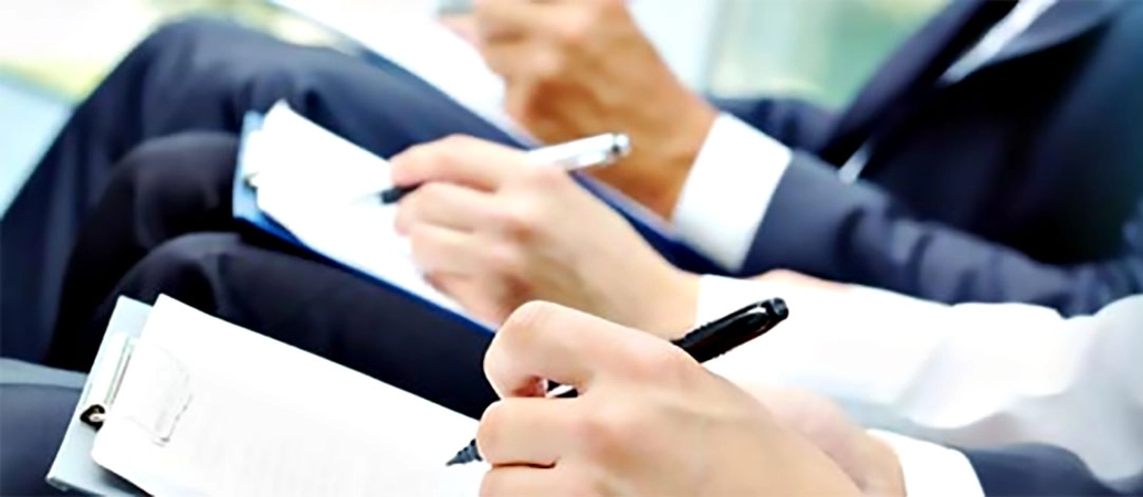 People note taking at a meeting