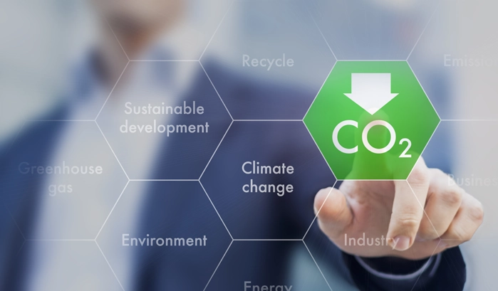 Image depicting a man pressing a button that will reduce CO2