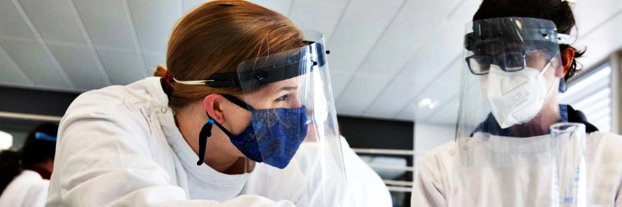 Two students working in the lab, Trinity College Dublin.