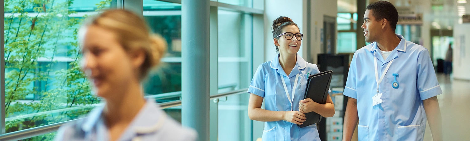 four young nurses walking along in the hospital