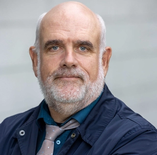 Dr. John Conama