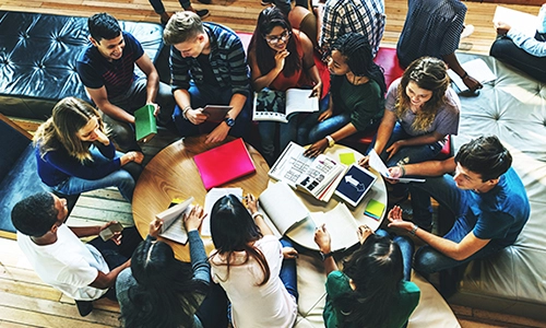 Students around circular tables
