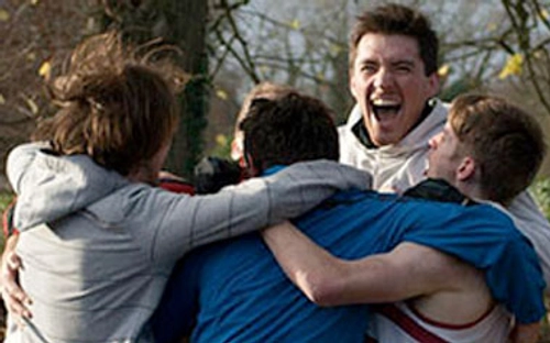 group of students hugging in celebration