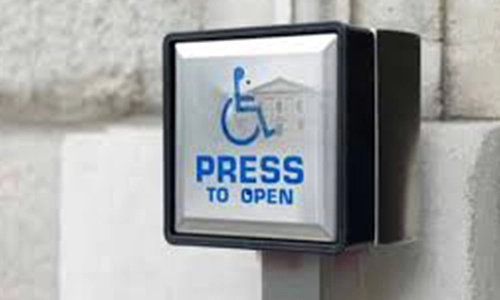 Press to open sign on a wheelchair access door push