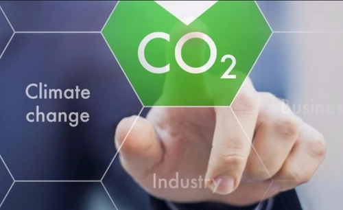 Finger pushing a button that lowers CO2