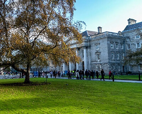 People walking through the grounds of Trinity College Dublin