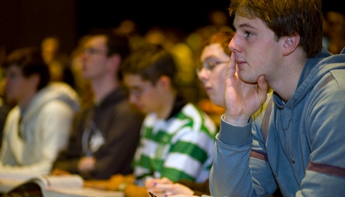Students in a lecture theatre listening to a lecture