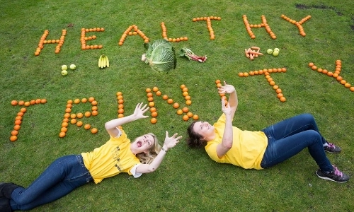 Healthy Trinity written on grass