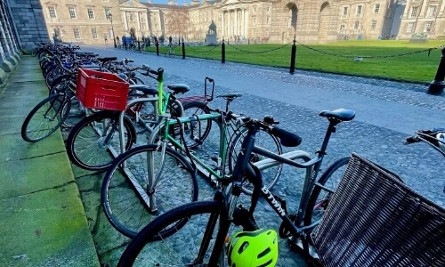 A row of locked bikes on the Trinity Campus