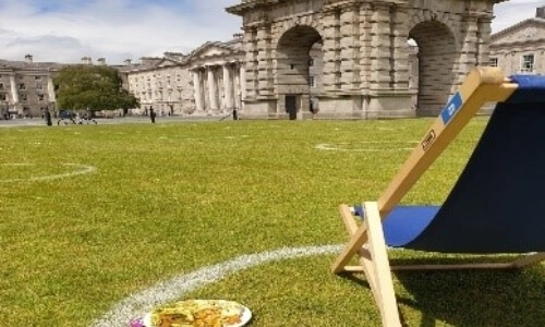 A deckchair overlooking the campanile at Trinity