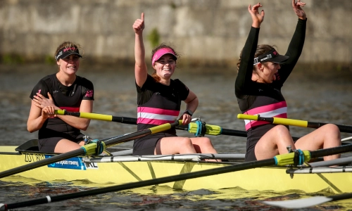 Three student female rowers.