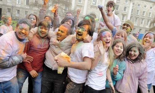 Students celebrating Holi in Trinity Front Square.