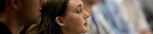 Dual BA students paying attention in a lecture.