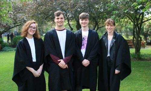 Three law students with gowns
