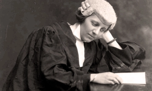 Frances Kyle reading a law document