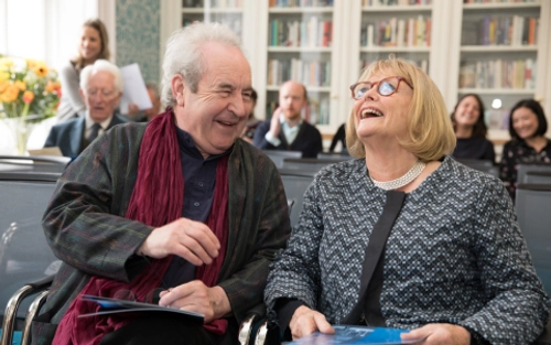 Two people laughing at an event in Trinity Centre for Literary Translation.