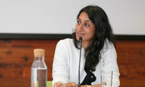 Woman speaking at microphone