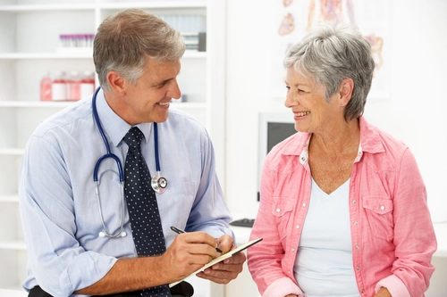 Image of older lady consulting with doctor