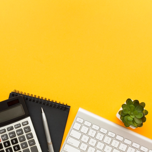 Stock image - credit: Microsoft - yellow background, succulent plant, calculator docs and computer keyboard