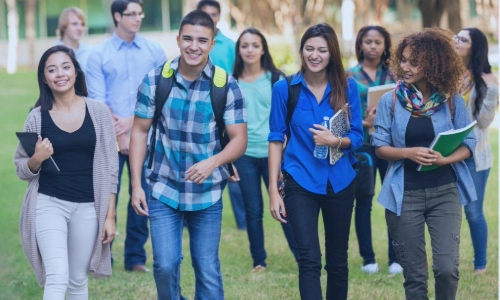 ten students walking in a park