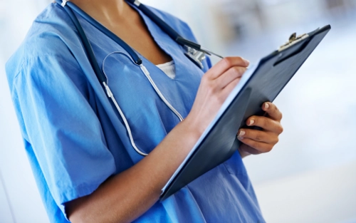 Nurse filling out prescription