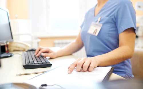 Nurse using computer