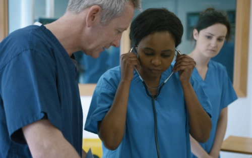 Nurse uses stethoscope