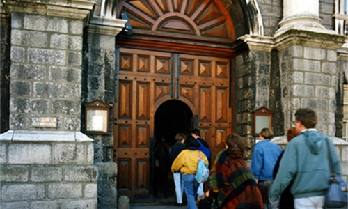 People entering the main entrance to Trinity College