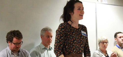 Image for Women in Physics with a woman presenting to an audience