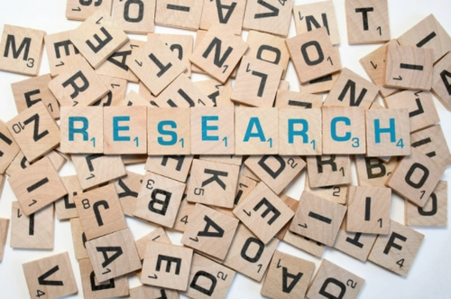 The word research written in scrabble pieces