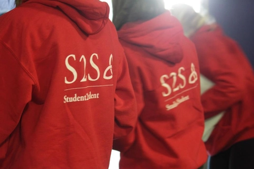People wearing the red S2S hoodies