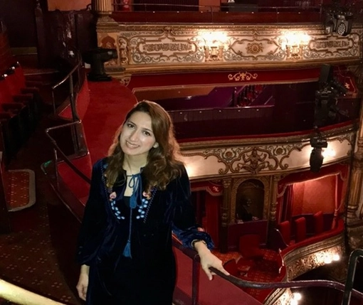 Dr. Dilek Öztürk Yağcı, Postdoctoral researcher standing in a theatre
