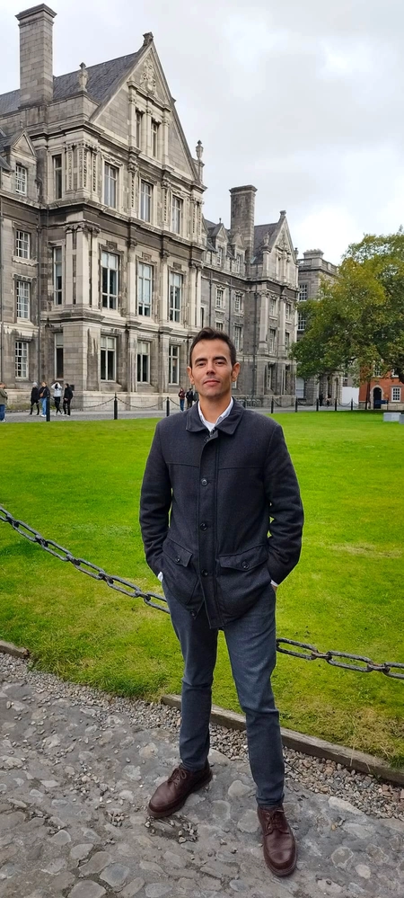 Ivan lopez standing outside a building and lawn