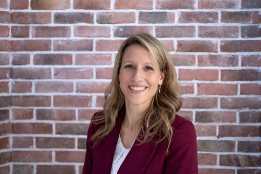 Vicky Bouché, Ph.D Researcher against a red brick background