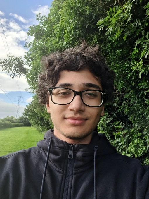 Student with curly short dark hair