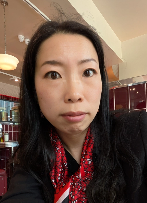 Student with long black hair, looking at the camera.