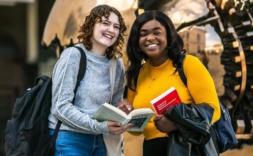 Two students in from of Berkley Library