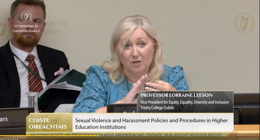 A seated woman speaking at the Oireachtas