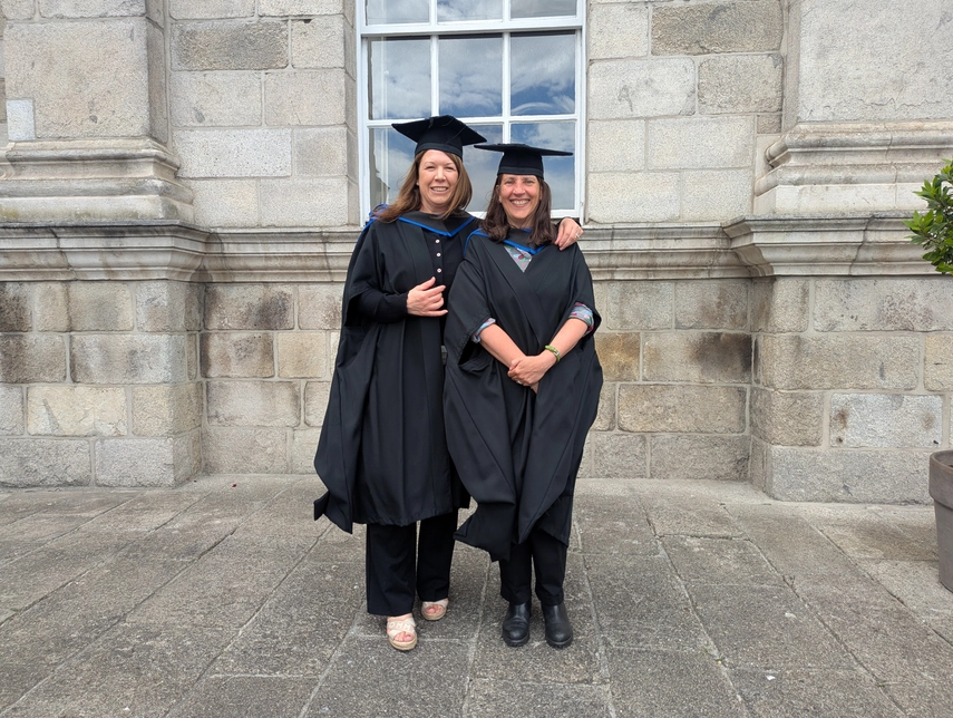 image of Sara and Nicola in graduation gowns