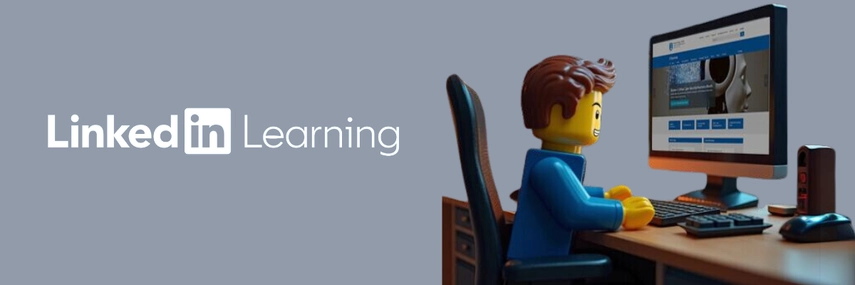 image of a lego man sitting at computer desk