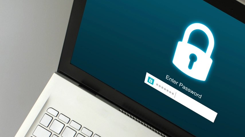 Image of a locked laptop with password being typed