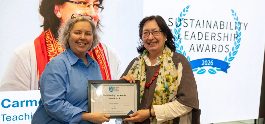 Provost Dr Linda Doyle presenting a framed certificate to Carmen Sanjulián.