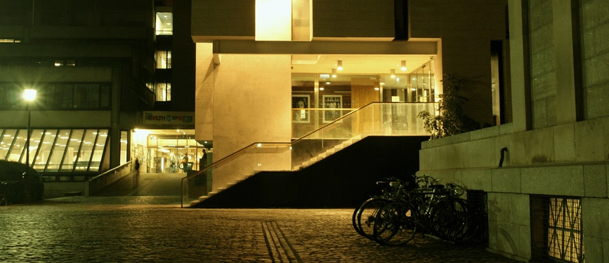 Trinity Long Room Hub, illuminated in the evening.